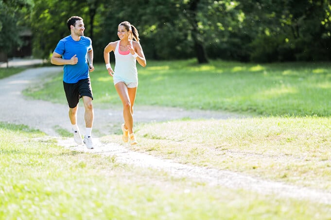 Young people jogging and exercising in nature